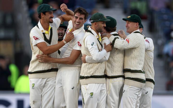 Bowler Pat Cummins (bareheaded) celebrates having Rory Burns caught during the 4th Ashes Test Match between England and Australia at Old Trafford, Manchester on 7th September 2019. Copyright photo: Graham Morris / www.photosport.nz