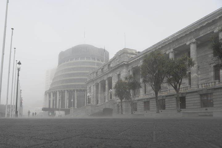 Parliament House and the Beehive wreathed in heavy mist during winter 2019 