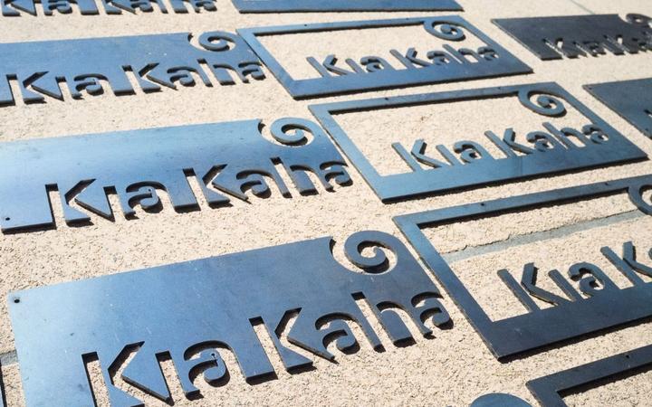 The Kia Kaha signs Conrad sold to raise $800 for charity after the attacks. 