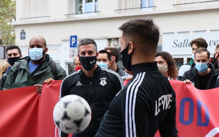 PARIS, FRANCE - OCTOBER 09: Sports fan and sports hall owners march towards French Health Ministry building from Raul-Dautry Square to protest government's coronavirus (Covid-19) measures pandemic measures in Paris, France on October 09, 2020. 