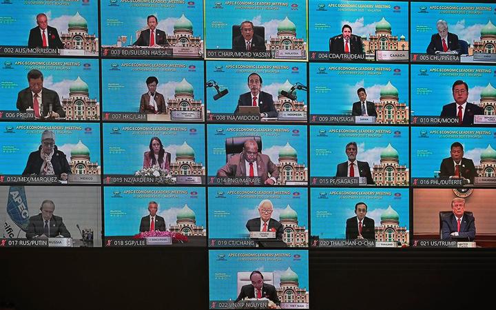 A screen shows the leaders' meeting, including presidents US President Donald Trump and NZ Prime Minister Jacinda Ardern, during the online Asia-Pacific Economic Cooperation (APEC) leaders' summit in Kuala Lumpur on 20 November 2020. 