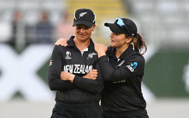 Suzie Bates and Amelia Kerr at the end of the match after losing to England. 