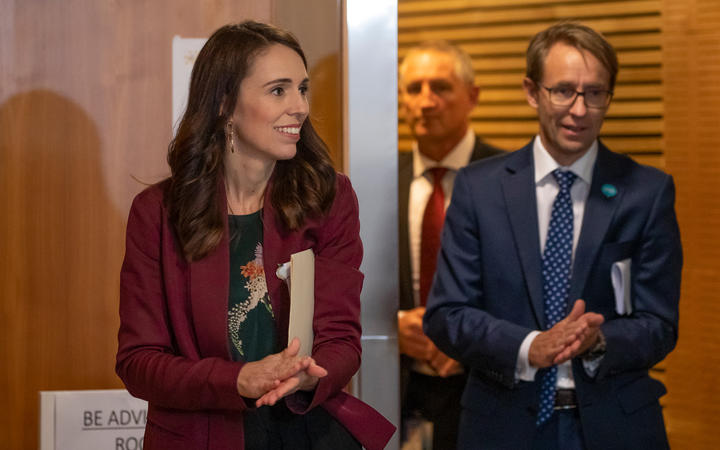 Prime Minister Jacinda Ardern sanitises her hands with Director-General of Health Dr Ashley Bloomfield while walking to a Covid-19 coronavirus briefing on 6 May, 2020.