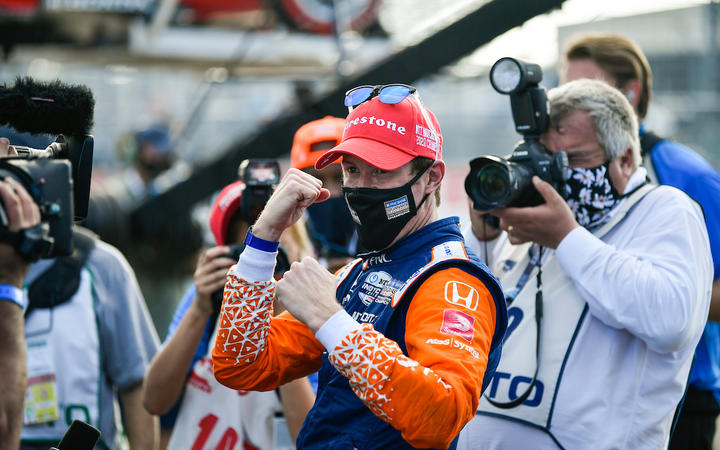 Scott Dixon wearing a mask along with media after his claiming his sixth series crown on 26 October, 2020.