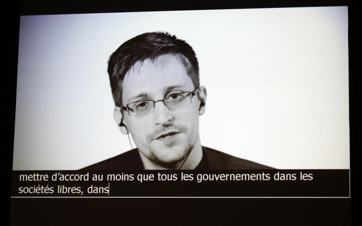 In this file photo taken on July 05, 2017 US intelligence contractor and whistle blower Edward Snowden delivers a speech by video conference during a masterclass at the Maison de la Radio, in Paris.