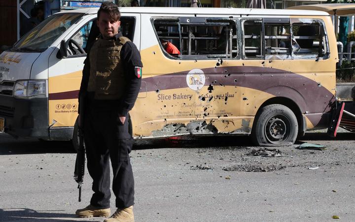 An Afghan security official inspects the scene of the rocket attacks in Kabul.