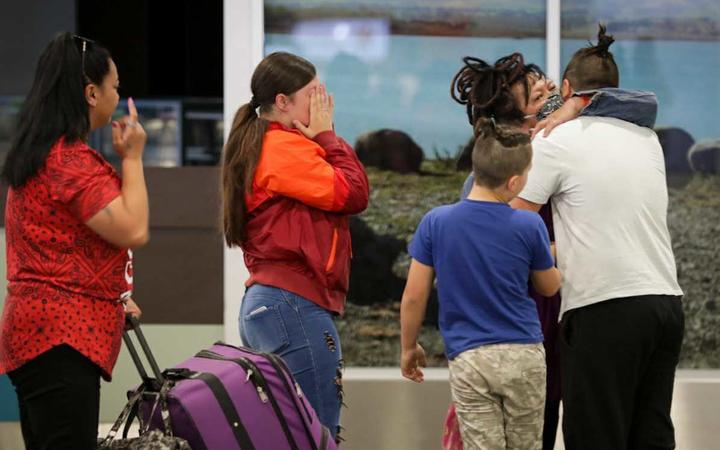 Loved ones embrace at Christchurch Airport 