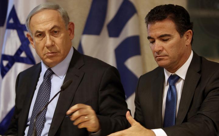 A file picture taken at the Israeli foreign ministry on October 15, 2015, shows Prime Minister Benjamin Netanyahu (L) sitting next to Yossi Cohen, who is currently the head of Israel's National Security Council, and who was named as the 12th head of the Mossad intelligence agency