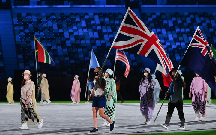 Britain's Laura Kenny carries her national flag during the closing ceremony of the Tokyo 2020 Olympic Games.