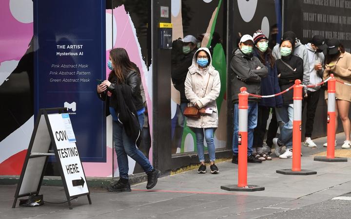 People queue at a Covid-19 coronavirus testing station in Melbourne on August 12, 2021 as five million people in Australia's second-largest city will remain under stay-at-home orders for at least another week.