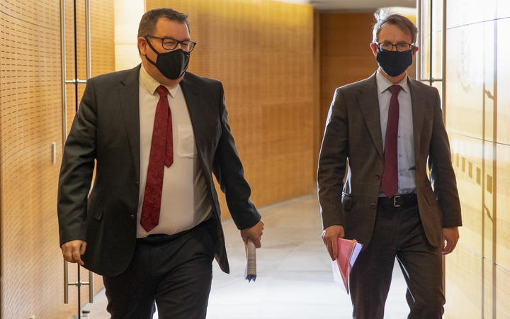 Deputy Prime Minister Grant Robertson and Director General of Health Dr Ashley Bloomfield arriving for the Covid-19 response and vaccine update at Parliament, Wellington.  24 August, 2021  NZ Herald photograph by Mark Mitchell