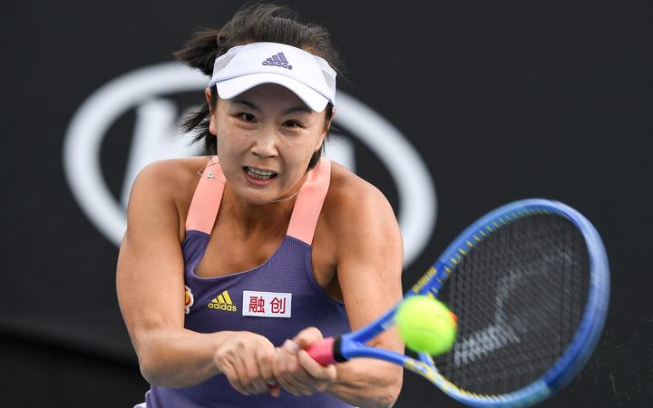 China's Shuai Peng hits a return against Japan's Nao Hibino during their women's singles match on day two of the Australian Open tennis tournament in Melbourne on January 21, 2020. 