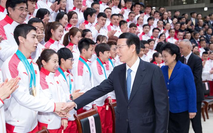 (180227) -- BEIJING, Feb. 27, 2018 (Xinhua) -- Chinese Vice Premier Zhang Gaoli meets with the Chinese delegation that returned home after the PyeongChang Winter Olympics, in Beijing, capital of China, Feb. 27, 2018. 