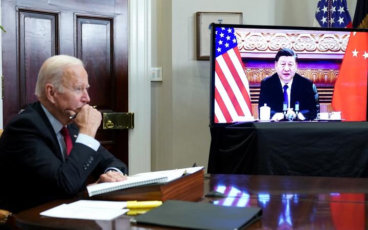 (FILES) In this file photo taken on November 15, 2021 US President Joe Biden meets with China's President Xi Jinping during a virtual summit from the Roosevelt Room of the White House in Washington, DC.