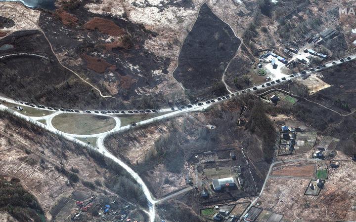 Satellite image taken by private satellite company Maxar shows that the 64-km long Russian military convoy reached outskirts of Kharkov, Ukraine, on Monday Feb 28, 2022. 