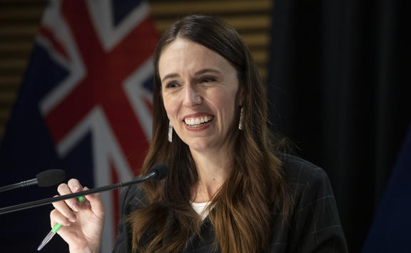 - POOL - Photo by Mark Mitchell.  Prime Minister Jacinda Ardern smiling during the post-Cabinet press conference with Energy Minister Megan Woods and Finance Minister Grant Robertson, Parliament, Wellington. 14 March, 2022.  NZ Herald photograph by Mark Mitchell