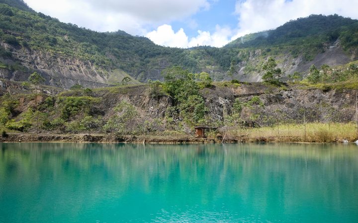 A lake in the pit of the long defunct Panguna mine in Bougainville.