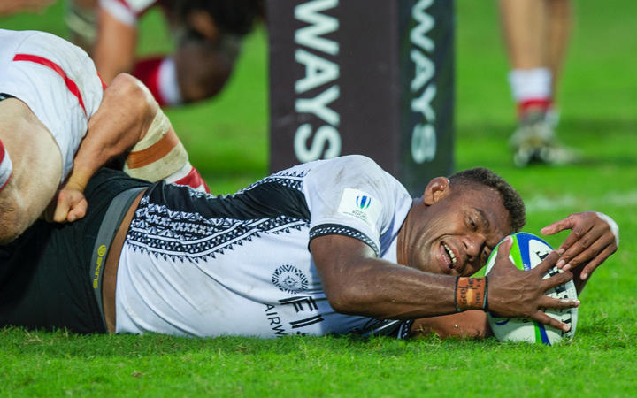 Fiji captain Leone Nakarawa stretches out to score against Canada