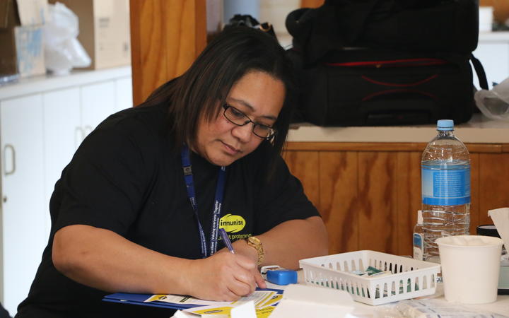 Community nurse Sita Moala working at the measles vaccination drop in centre at the Free Church of Tonga in Mangere today.