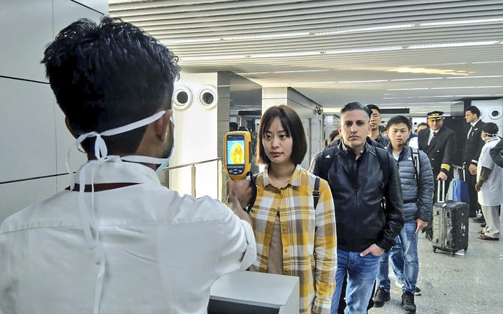 The Ministry of Civil Aviation uses a thermographic camera to screen the head of people at Netaji Subhash Chandra Bose International Airport in Kolkata following the outbreak of CoV2019.