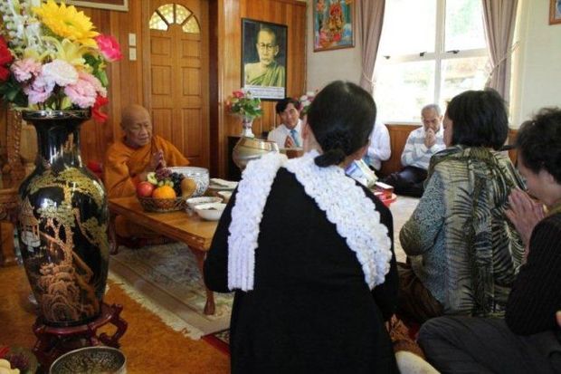 Senior Venerable Leading the prayers during the festival