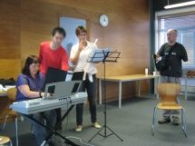 Mike Gourley records audio, while Alison, Collin and flautist Vicky prepare for rehearsal