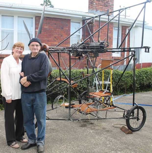Flight Ivan Mudrovcich and his wife Janet in front of the frame of the Pearse aircraft reproduction photo Lisa Thompson