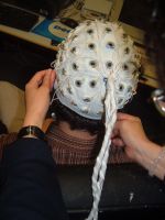 A participant in the study submits to being wired up.