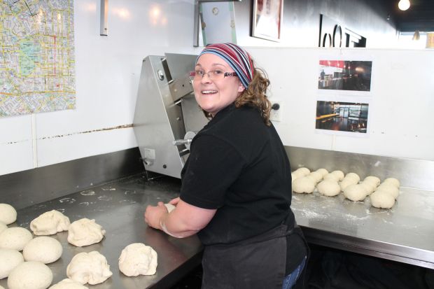 Active in Hell Trainee Bridget Chamberlain balling dough at the Riccarton branch
